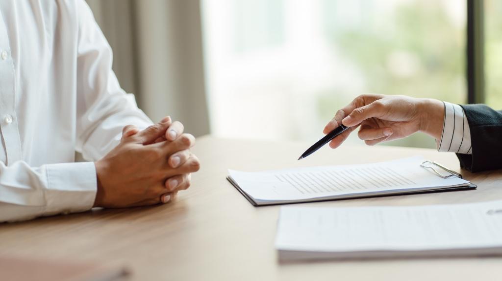 Person explaining insurance to a business owner