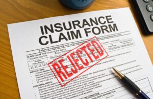 Insurance Claim Form with Red Rejected Stamp