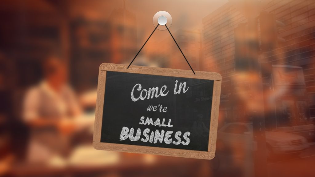 Come In We're a Small Business Sign Hanging in a Window