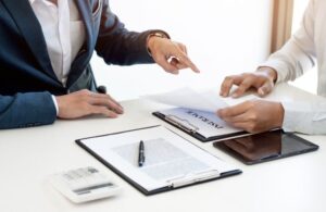 Lawyer Consulting with Client About Life Insurance