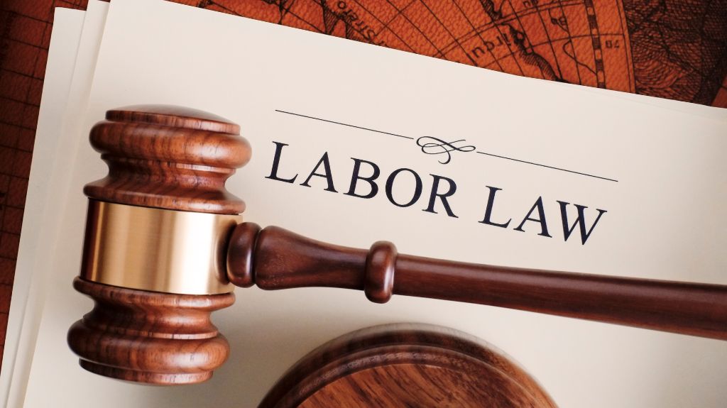 Labor Law Documents with Gavel on a Desk